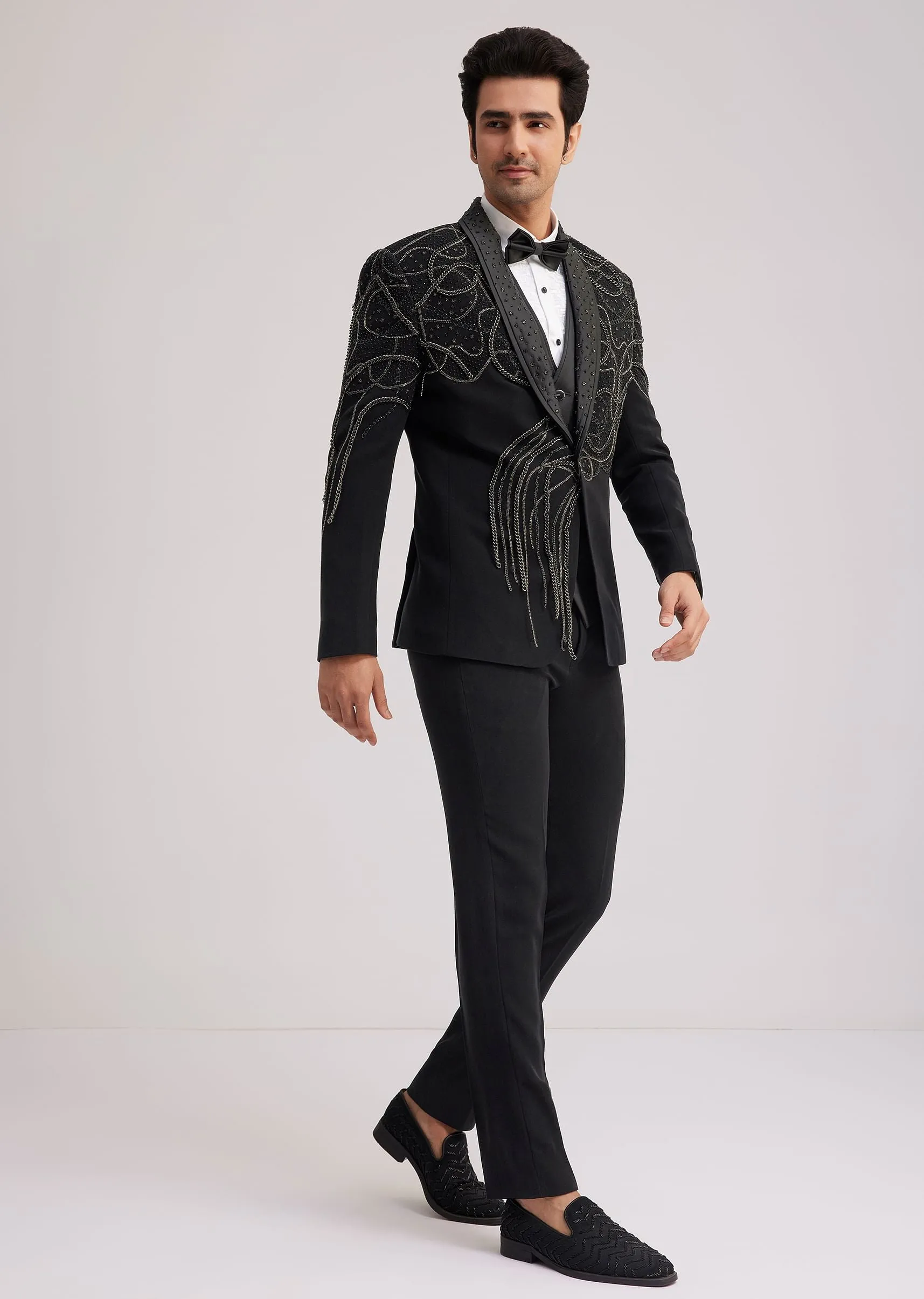 Black Suiting Tuxedo With Metallic Chain And Stone Work